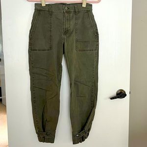 Olive colored khaki style pants with snap hem